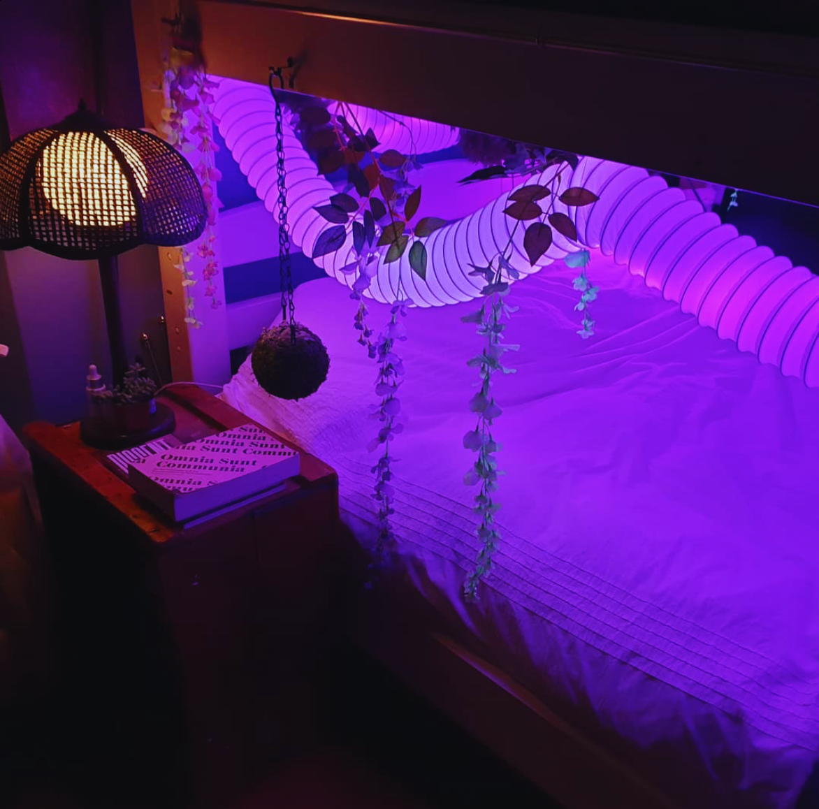 A purple-lit bedroom nook in the house